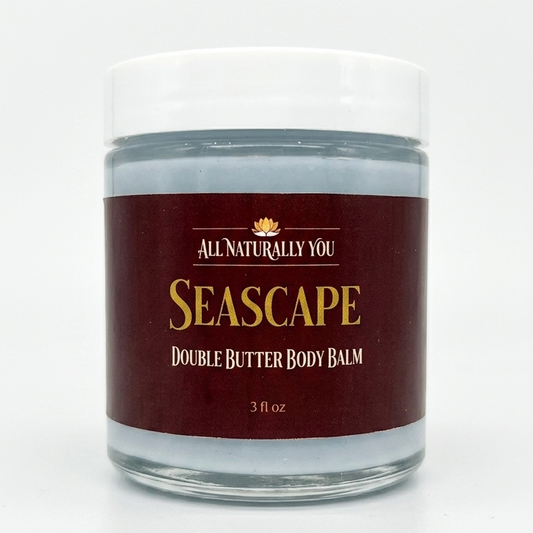 Jar of 'Seascape' double butter body balm with a maroon label on a white background